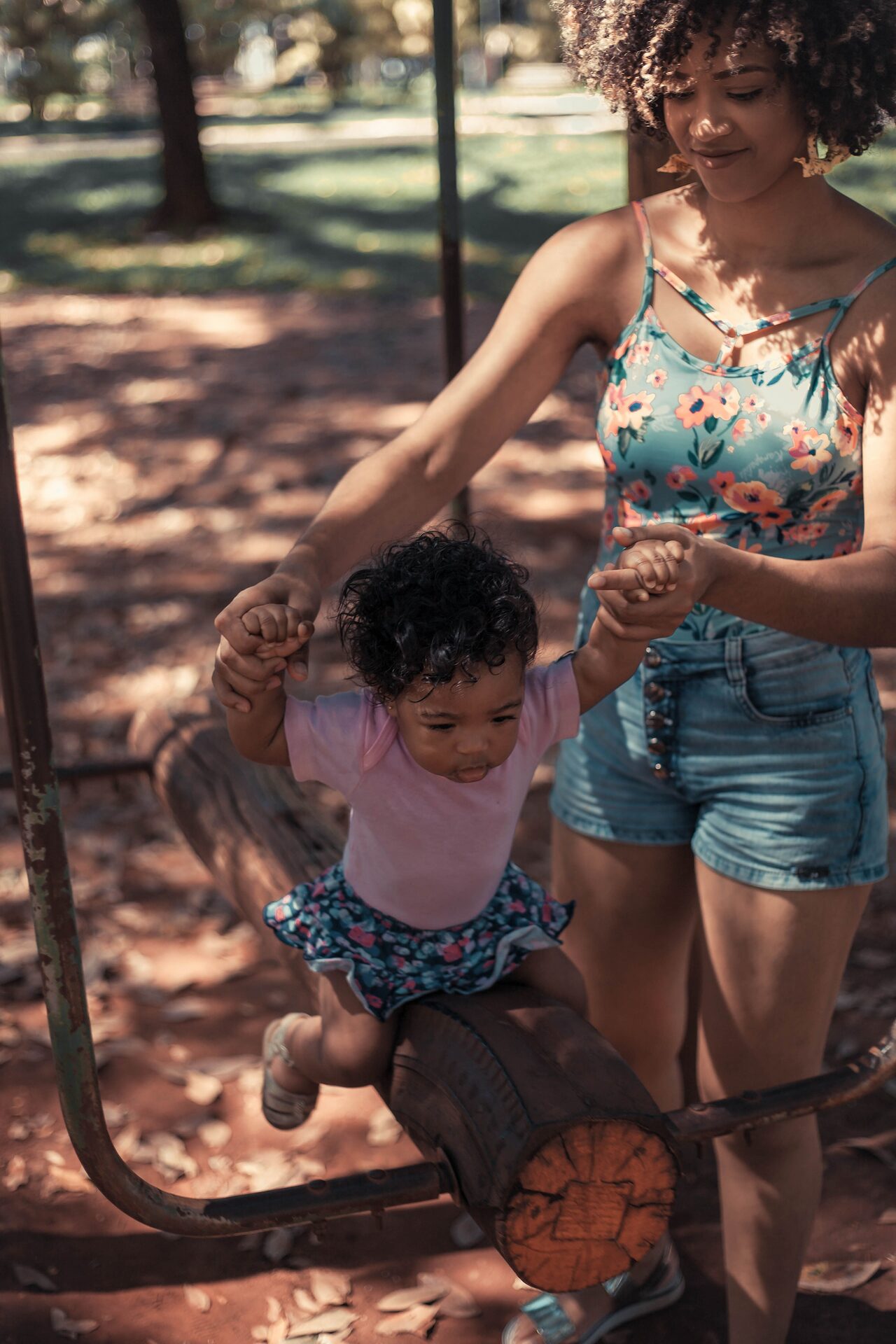 Mother and toddler on a playground