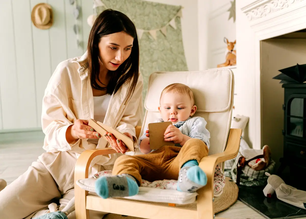 Mom and toddler playing with a wooden puzzle together at home